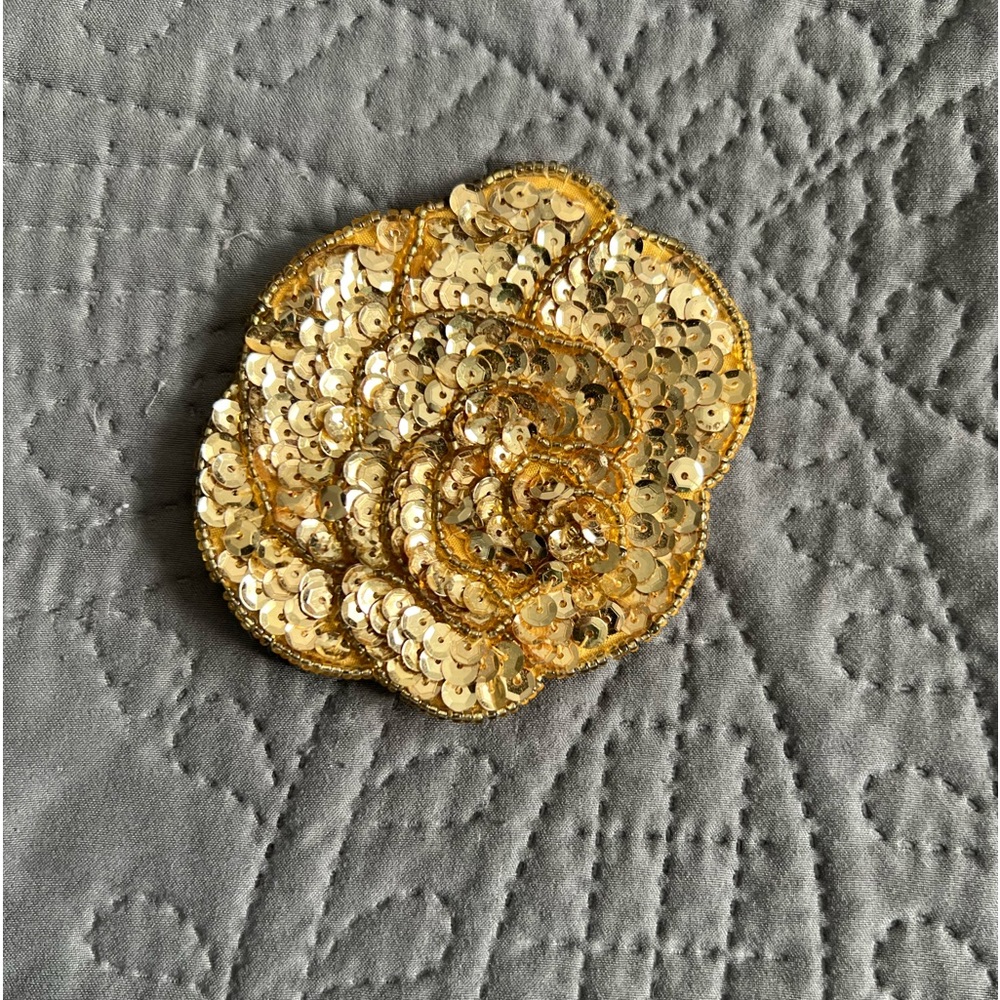 Vintage Charmant Belts buckle. Gold sequinned flower.